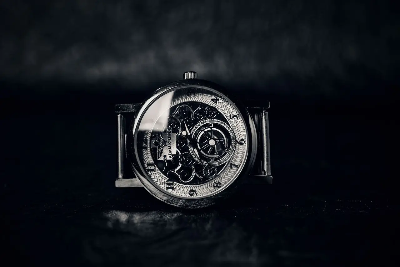 Vintage mechanical wristwatch showcasing precision escapement gears and polished casing